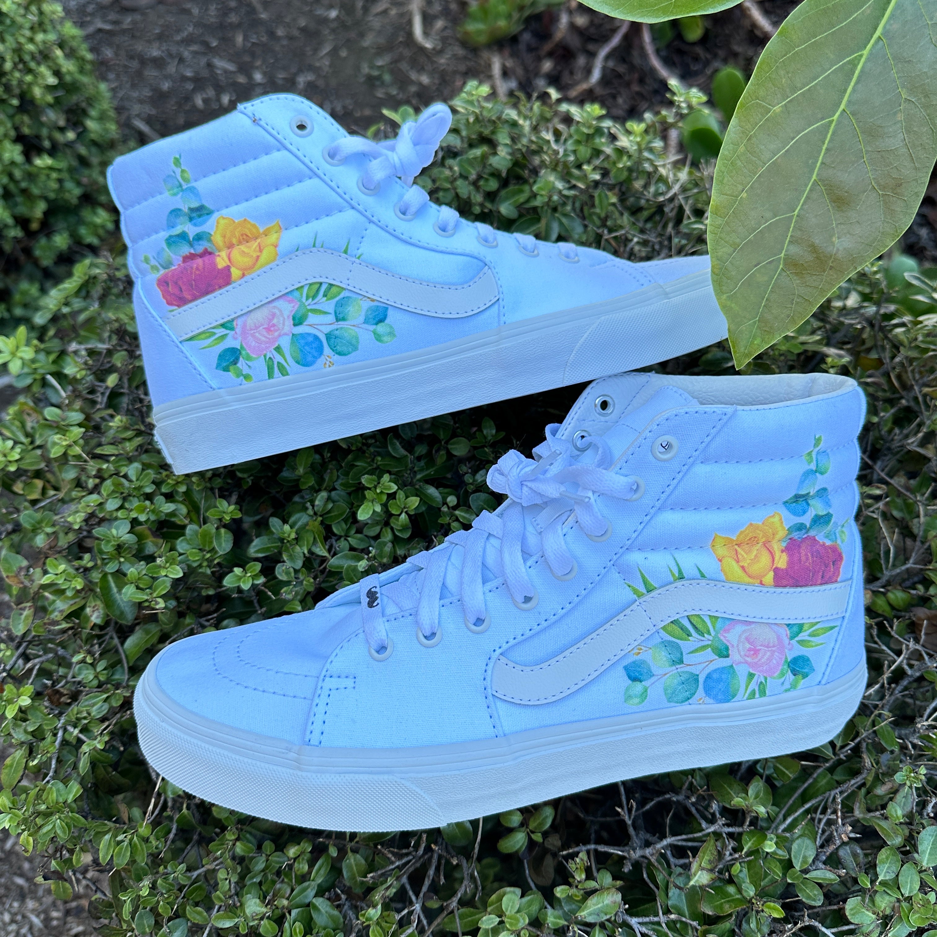 High top vans hotsell with roses on them