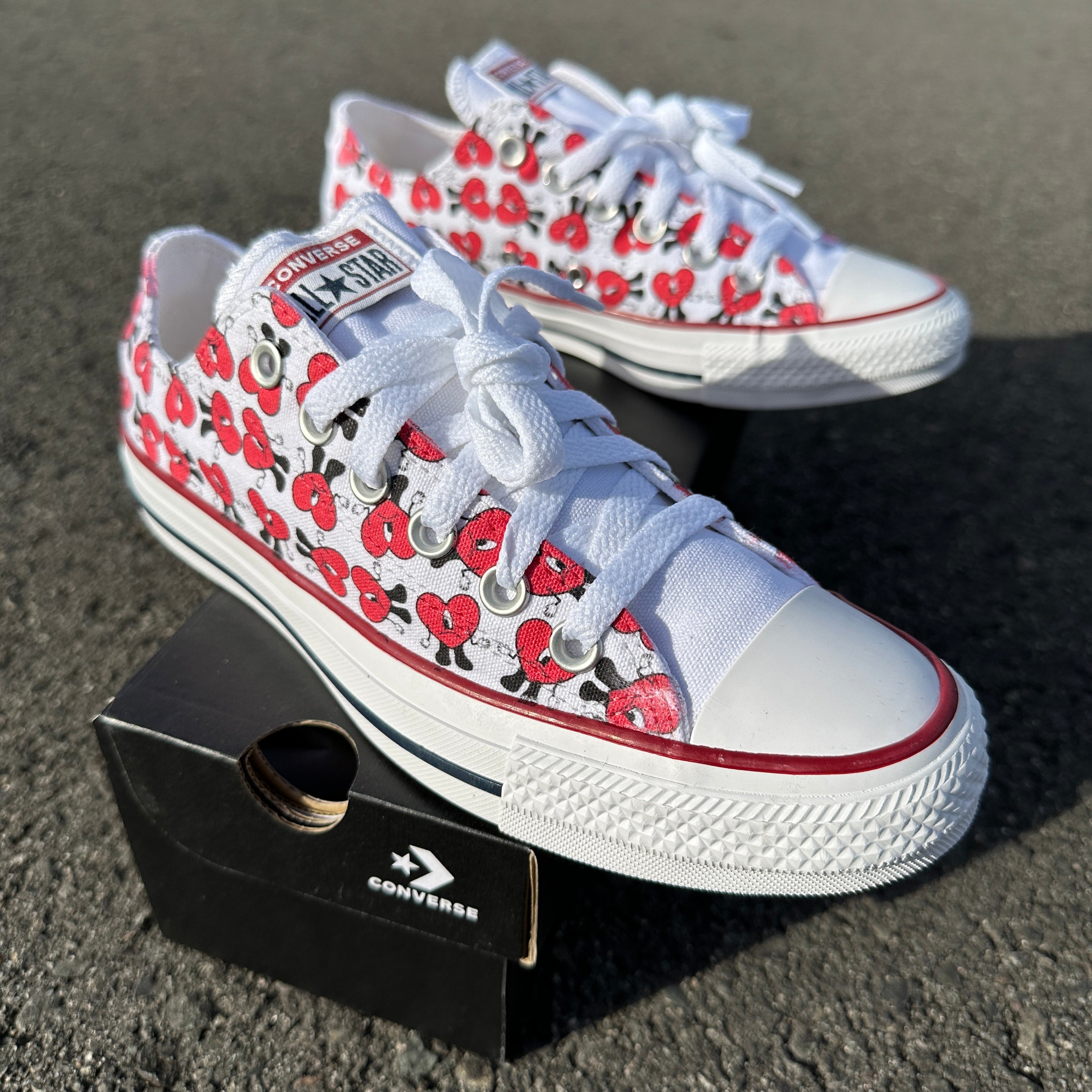 Red and white store low top converse