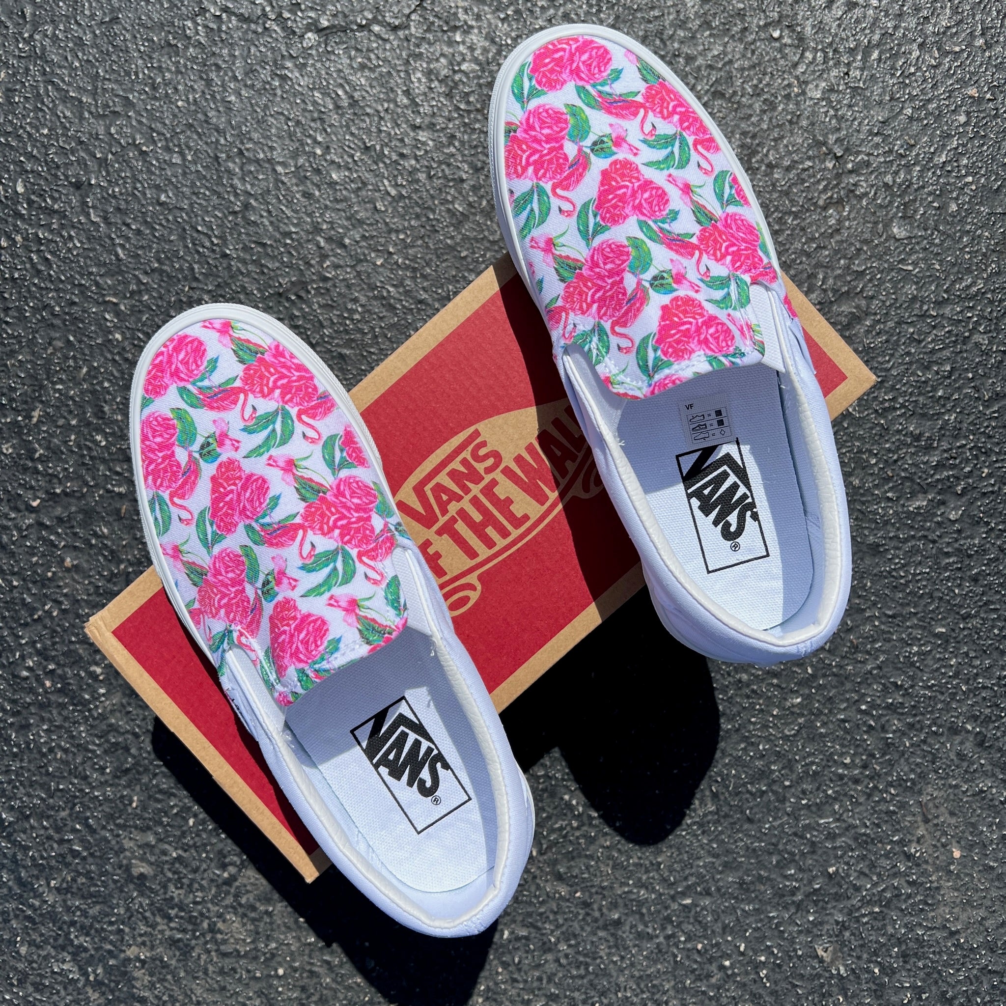 White slip on store vans with pink roses