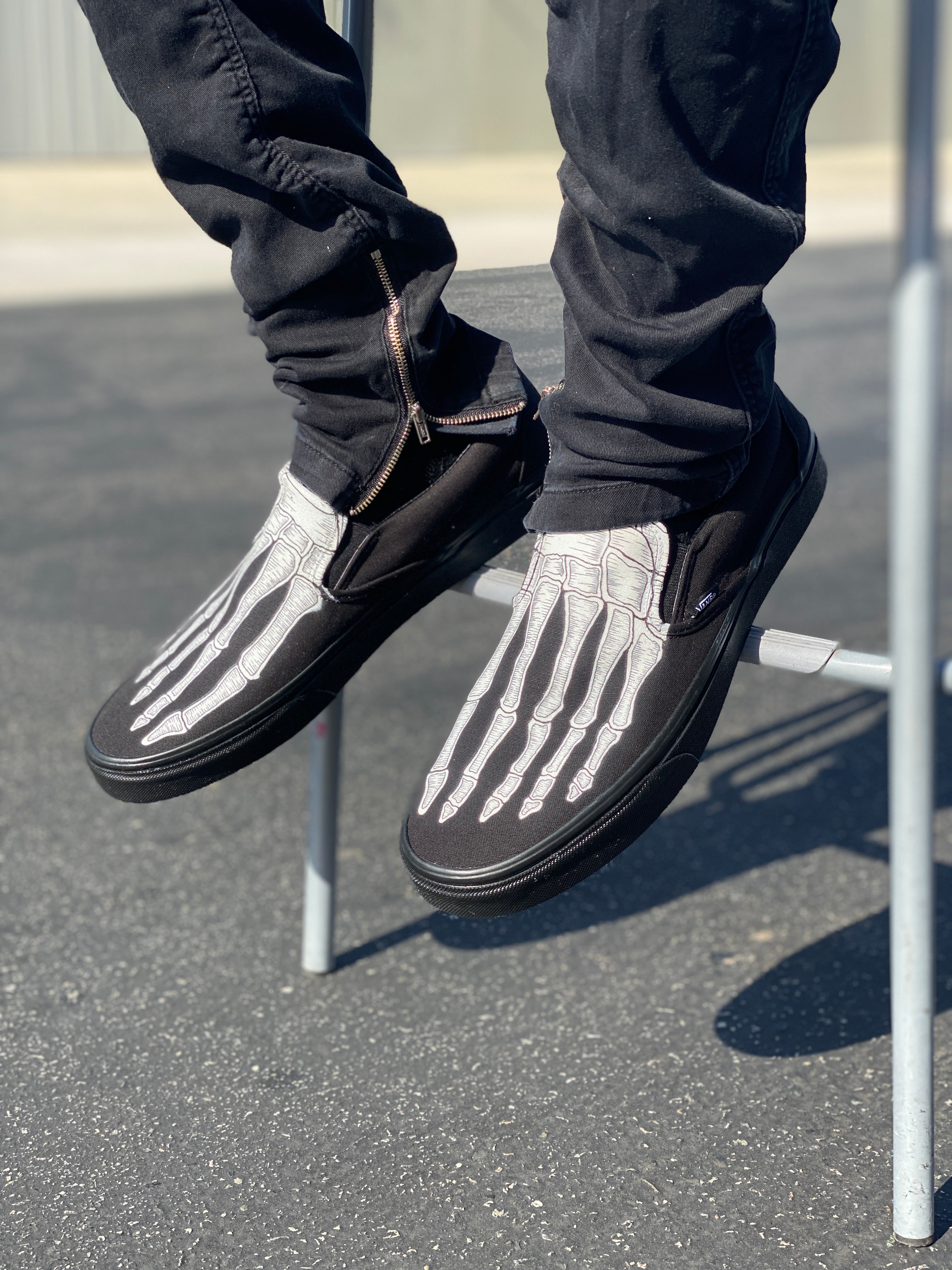 Black slip on store vans on feet