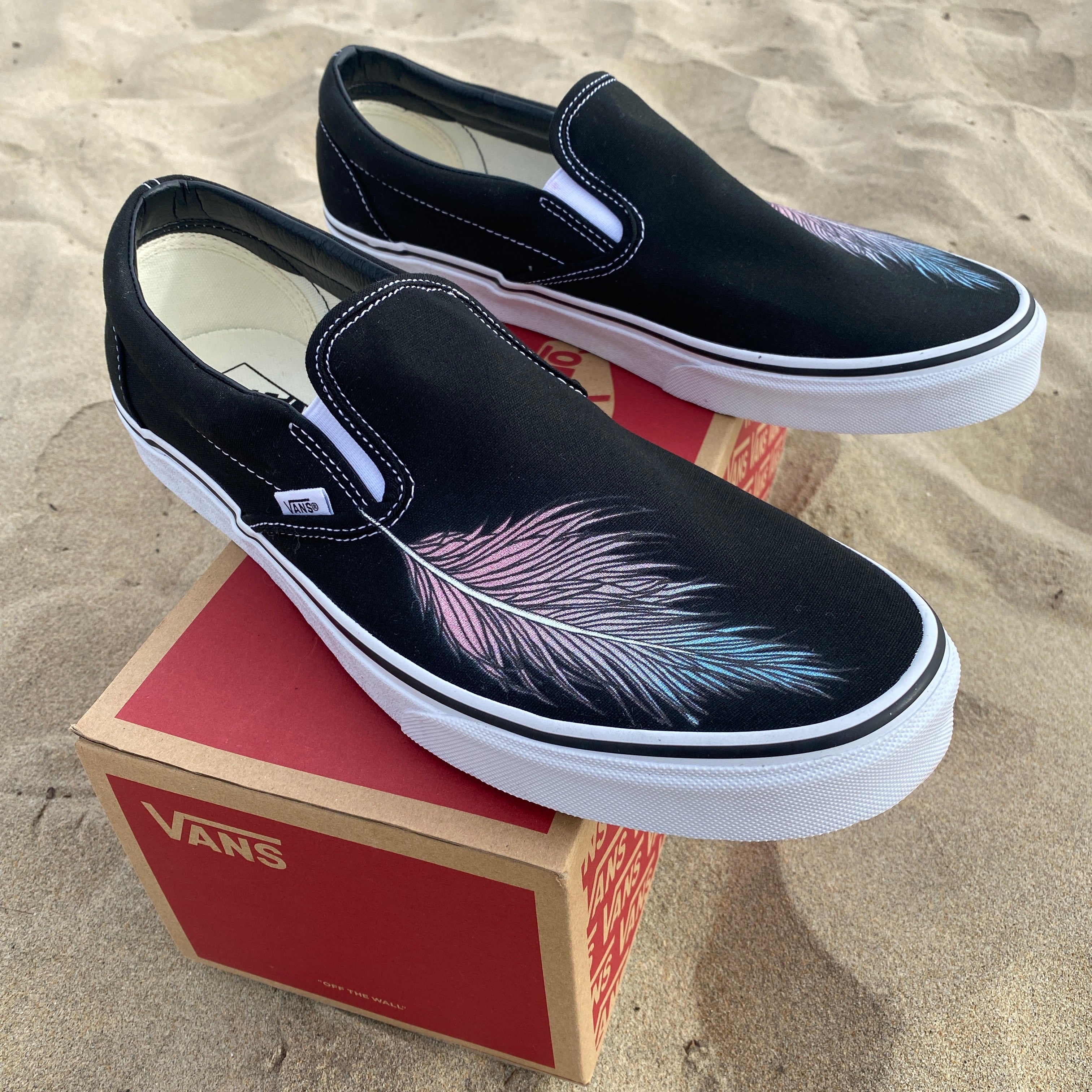 Vans slip ons black on clearance black